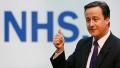 David Cameron with NHS sign